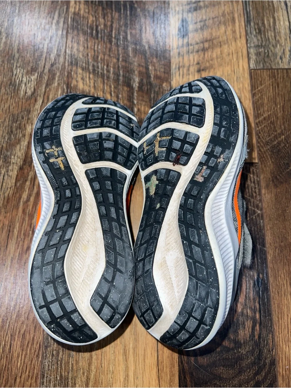 Nike Kids Light Gray and Black Sneakers with Orange Accents